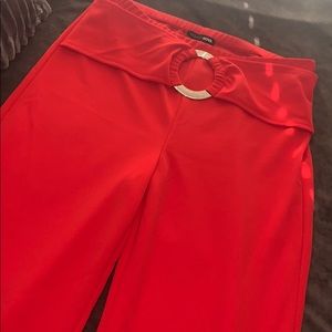 Red flare pants with gold detail